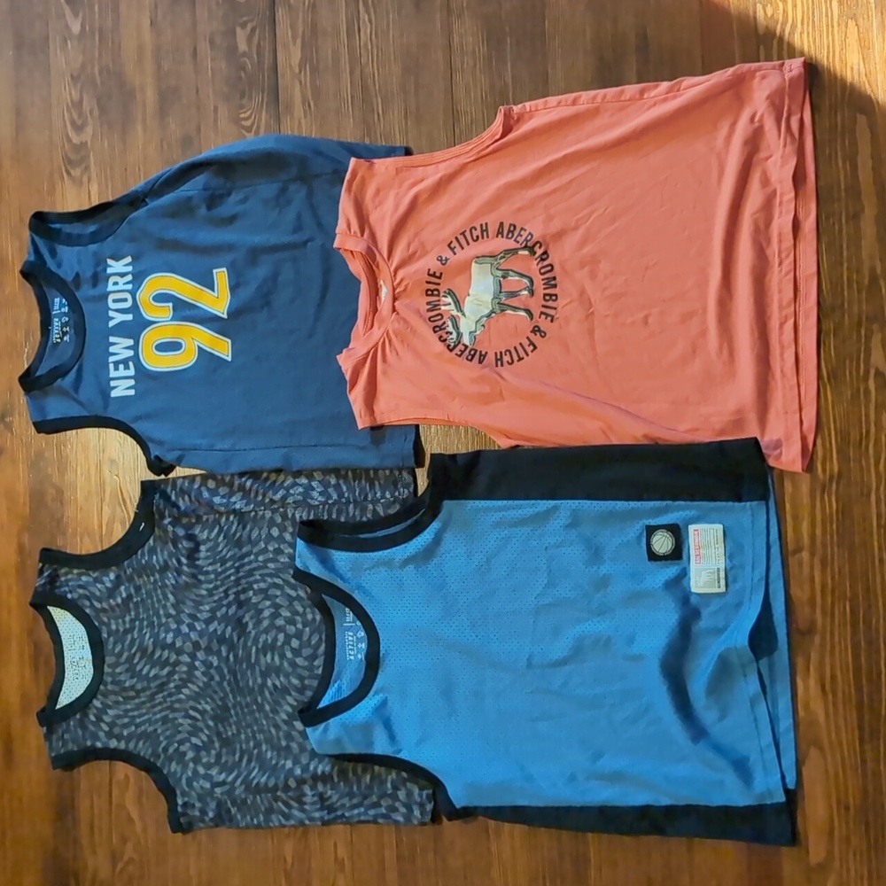 Lot Of Four Sleeveless Athletic Shirts